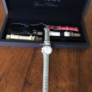 Invicta watch with five interchangeable bands.